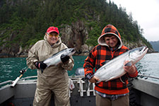 Grandpa and grandson catching a silver salmon double